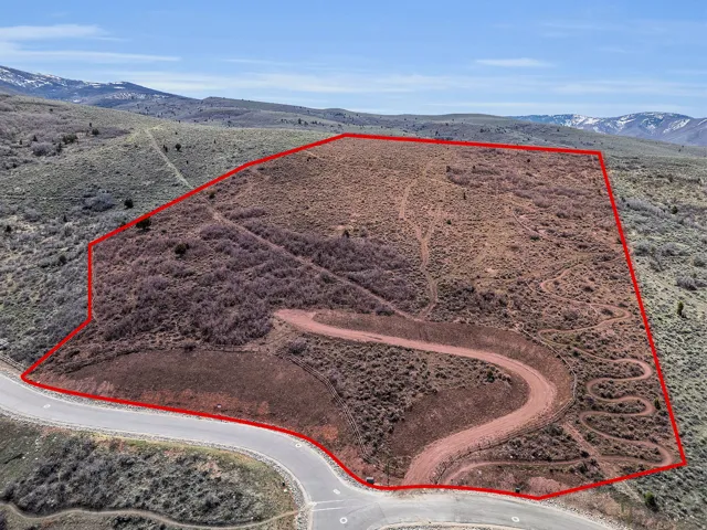 View of rural area with a mountainous background and property parcel outlined