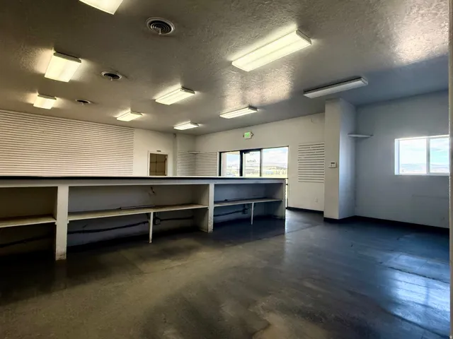 Miscellaneous room with a textured ceiling