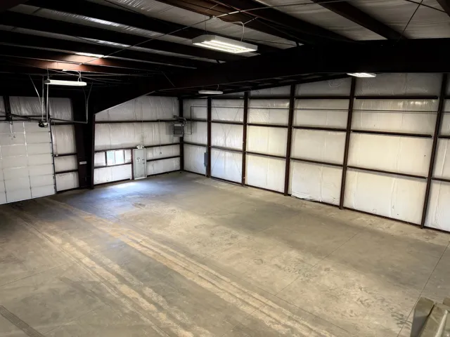 Garage featuring metal wall