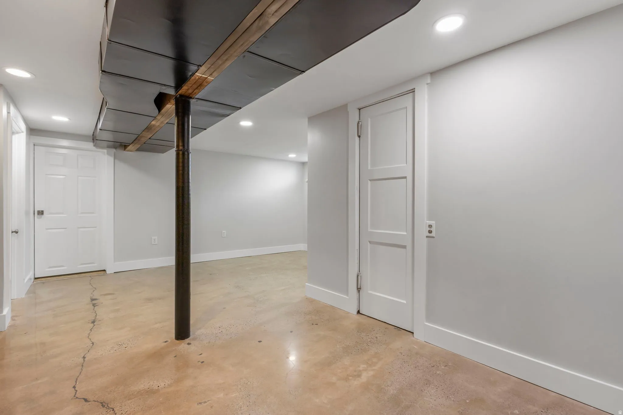 Finished basement featuring recessed lighting