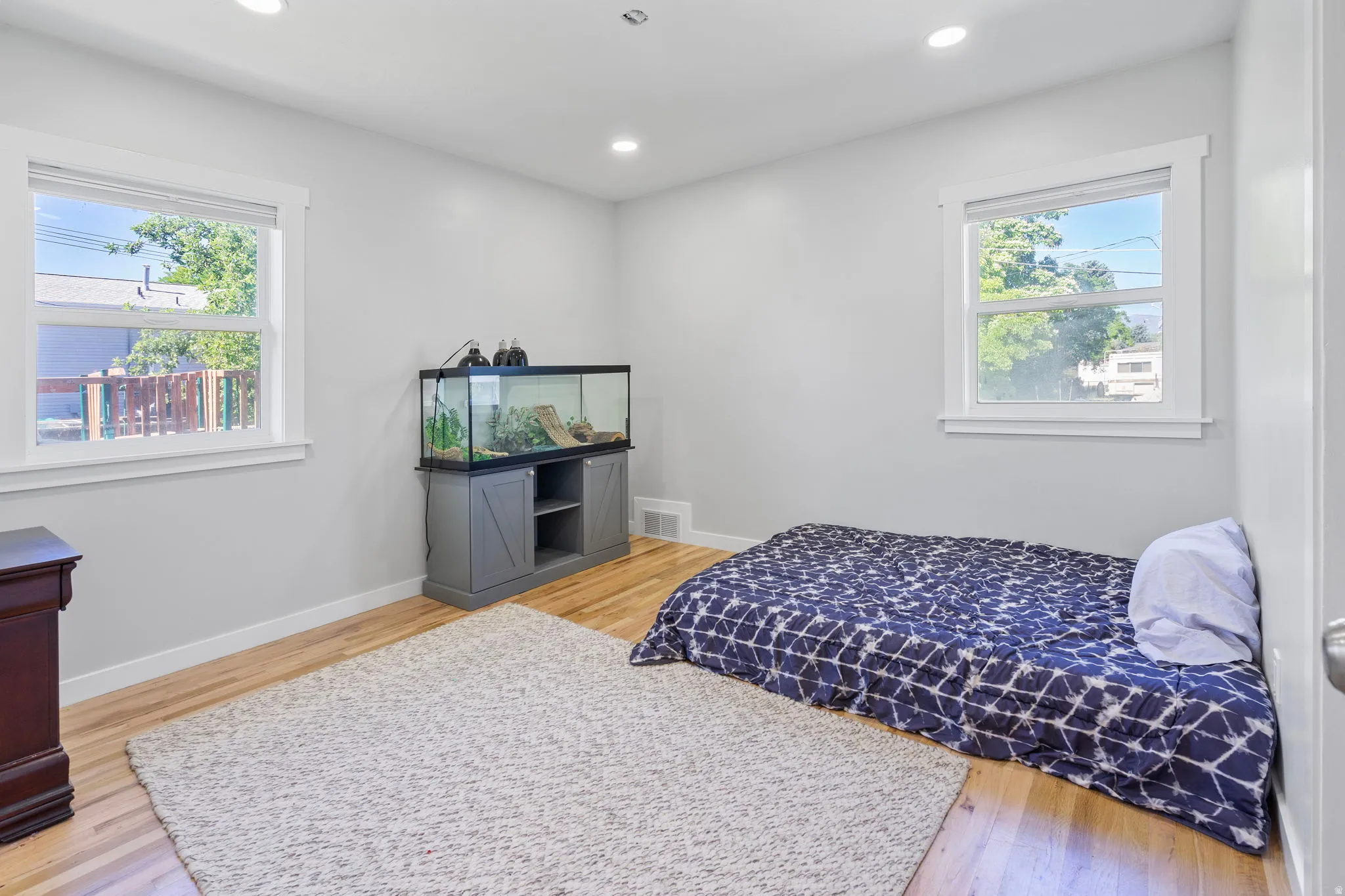 Bedroom with light wood-style flooring and recessed lighting