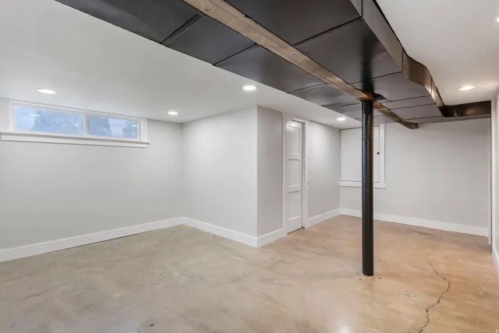 Below grade area with recessed lighting and baseboards
