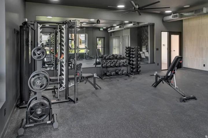 Gym featuring a ceiling fan