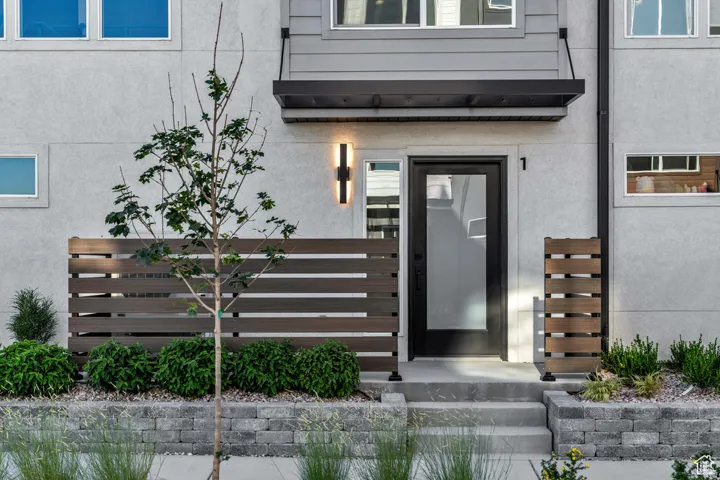 Property entrance with stucco siding