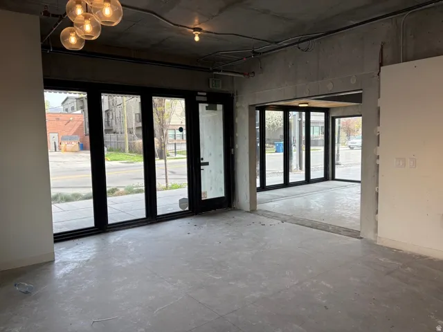 Spare room with concrete flooring and healthy amount of natural light
