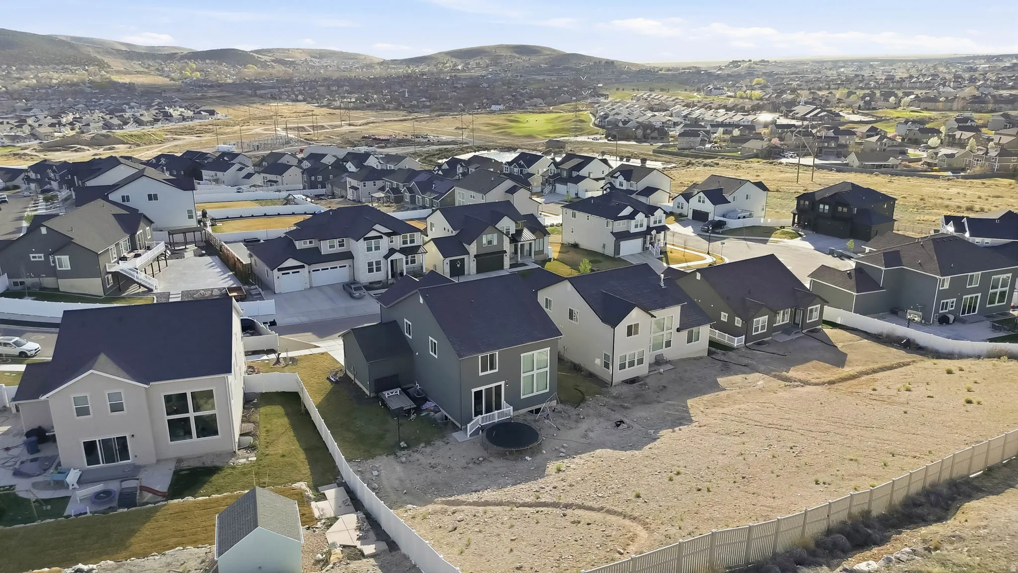 Aerial view of residential area featuring a mountain backdrop
