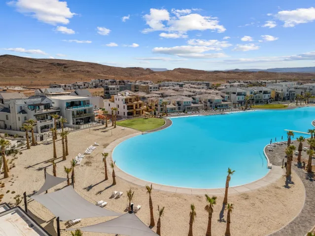 Community pool featuring a residential view and a mountain view