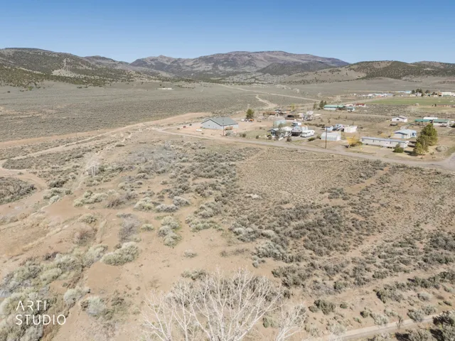View of mountain backdrop with a desert landscape and rural landscape