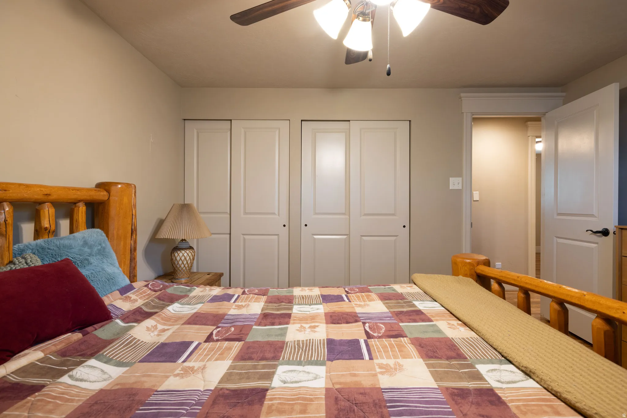 Bedroom with a ceiling fan and two closets
