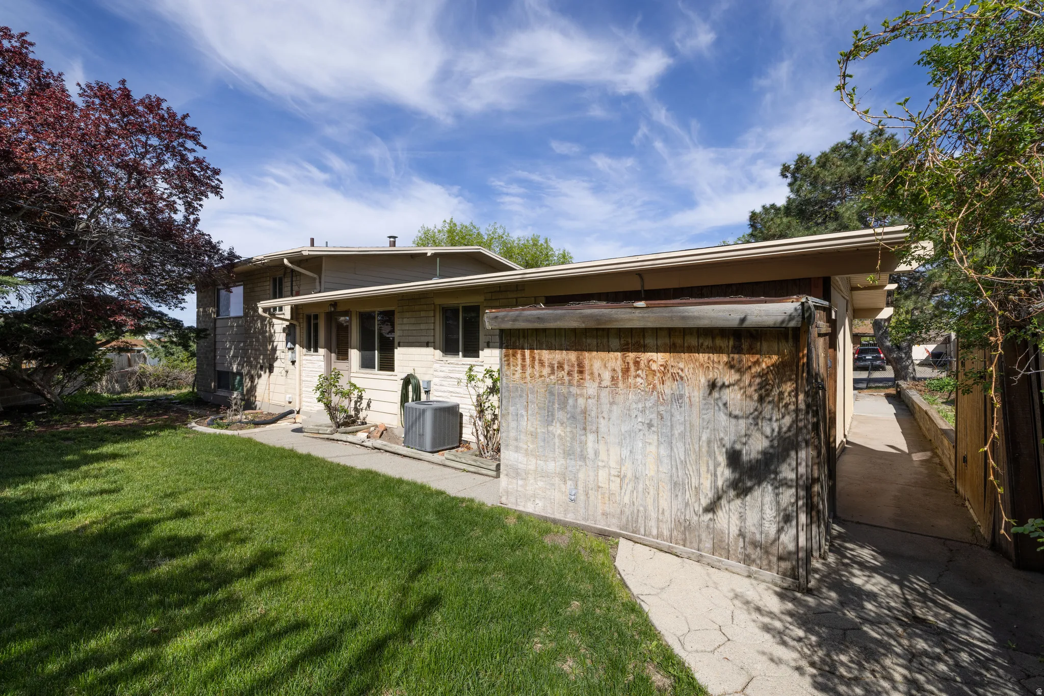 Back of house featuring a yard