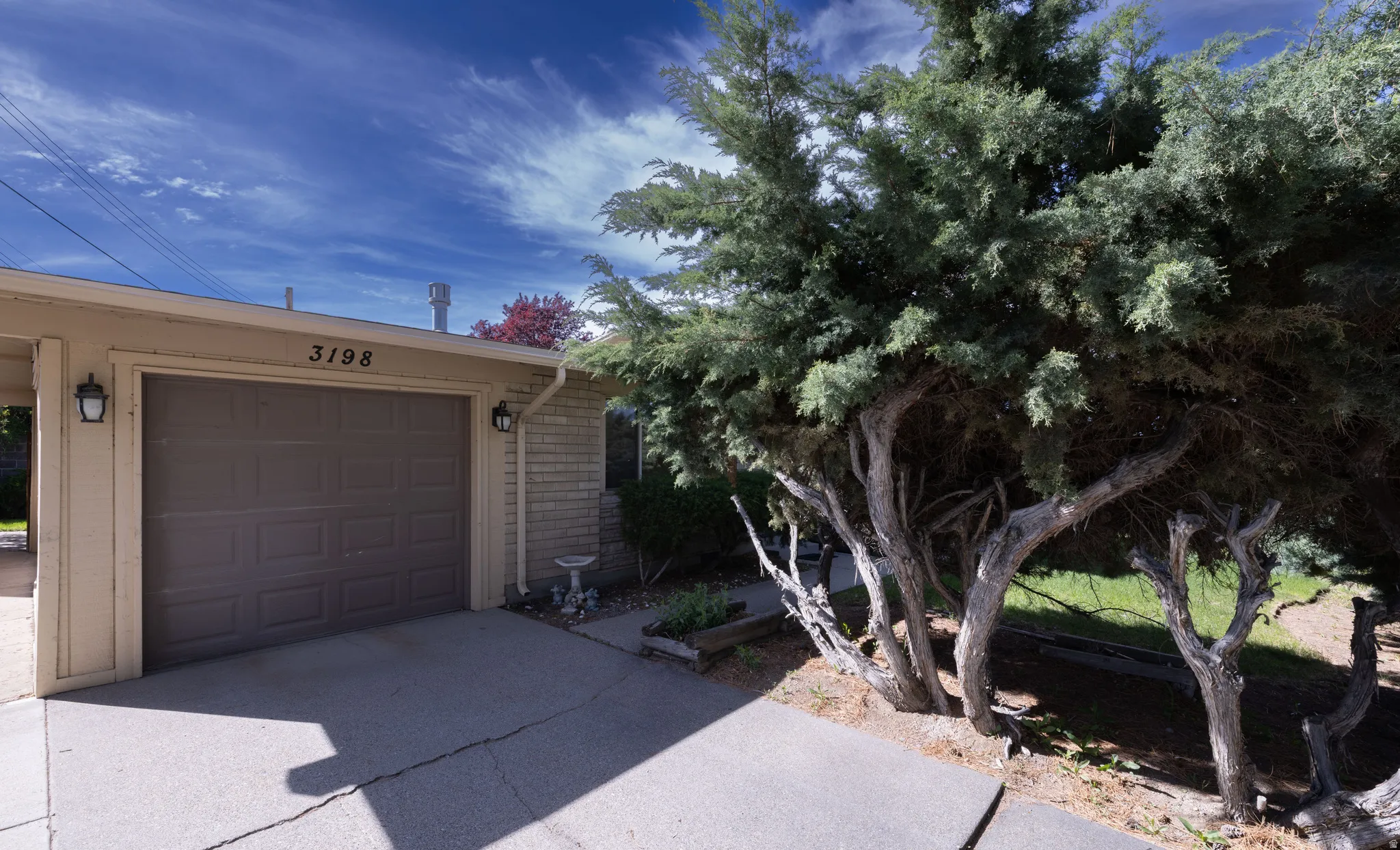Garage with concrete driveway