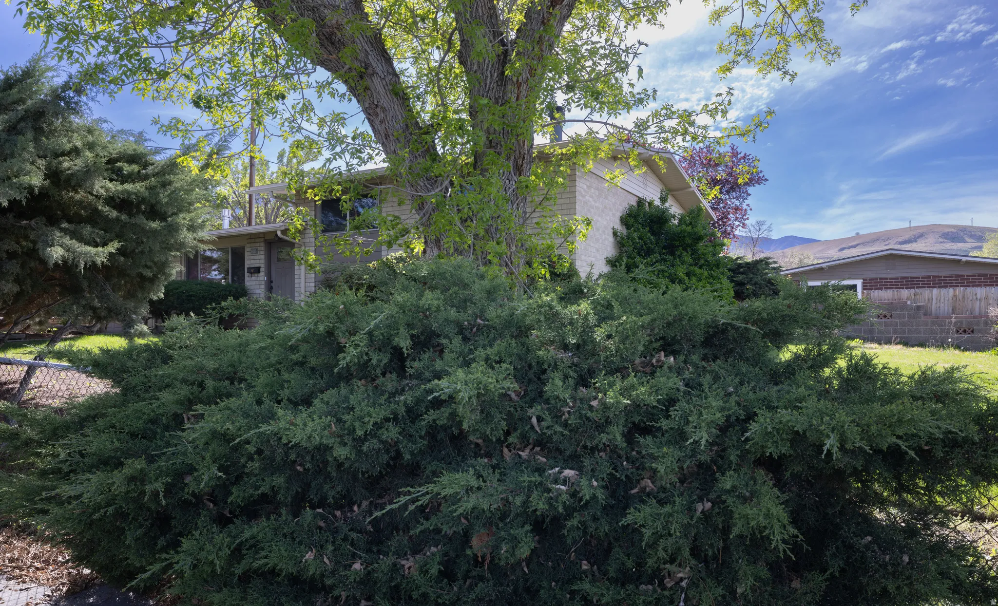 View of property exterior with a mountain view