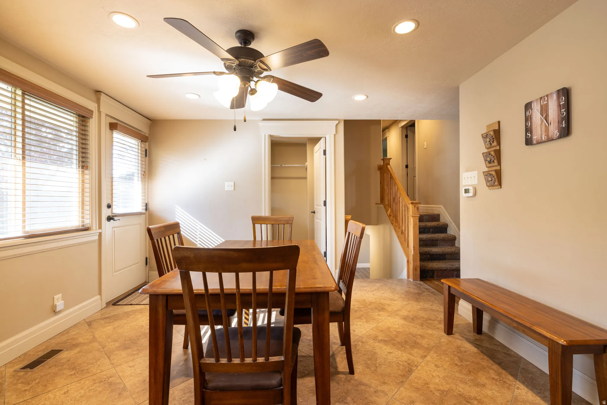 Dining area with recessed lighting and ceiling fan