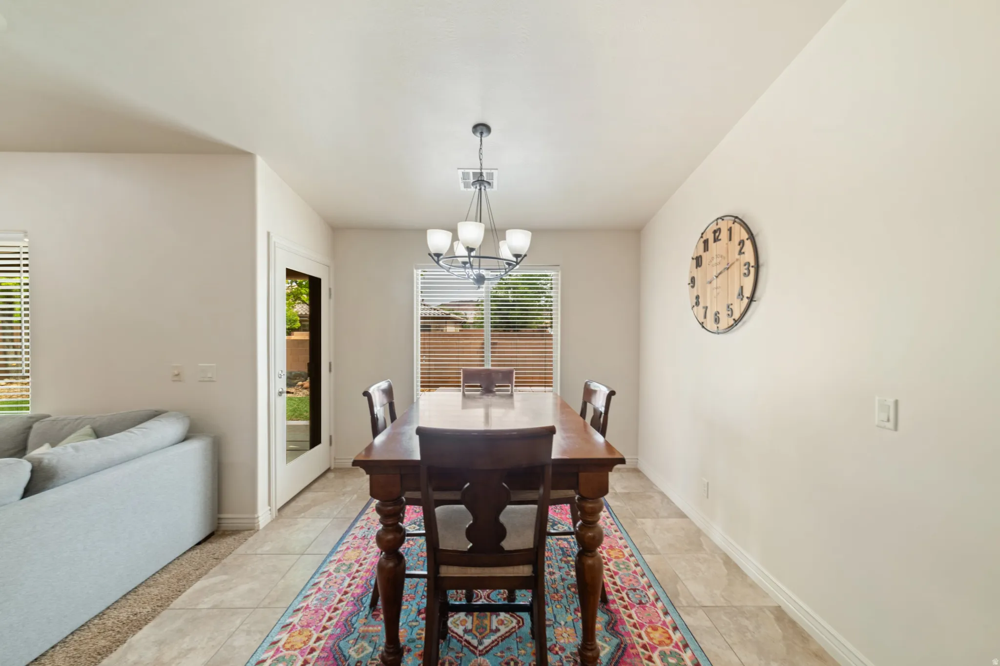Dining room featuring baseboards and suspended lighting