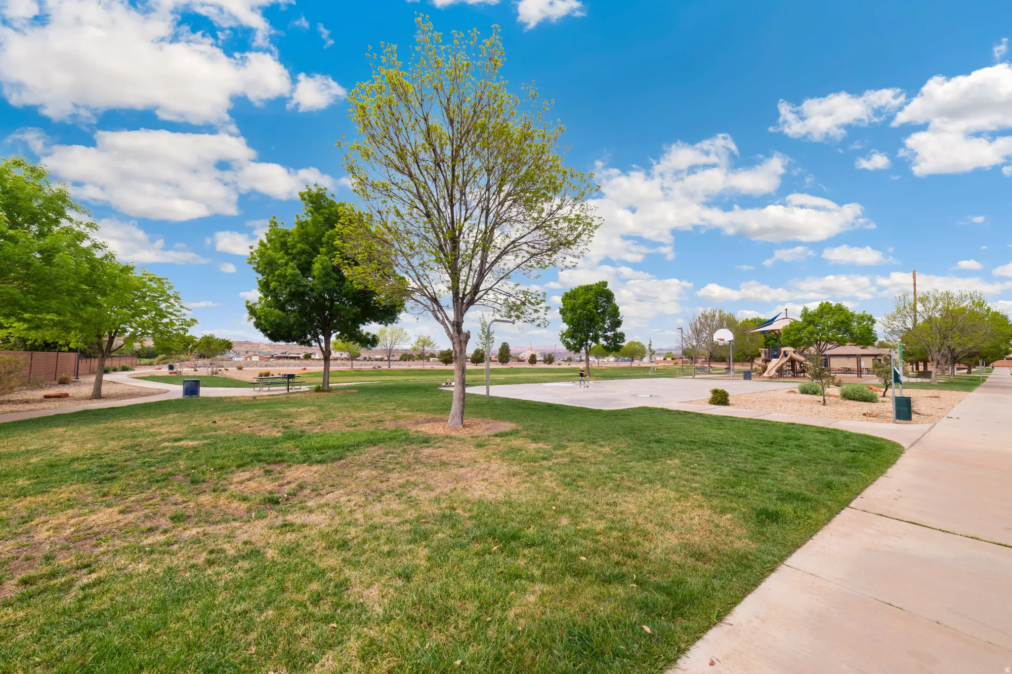 View of property's community featuring community basketball court and a patio