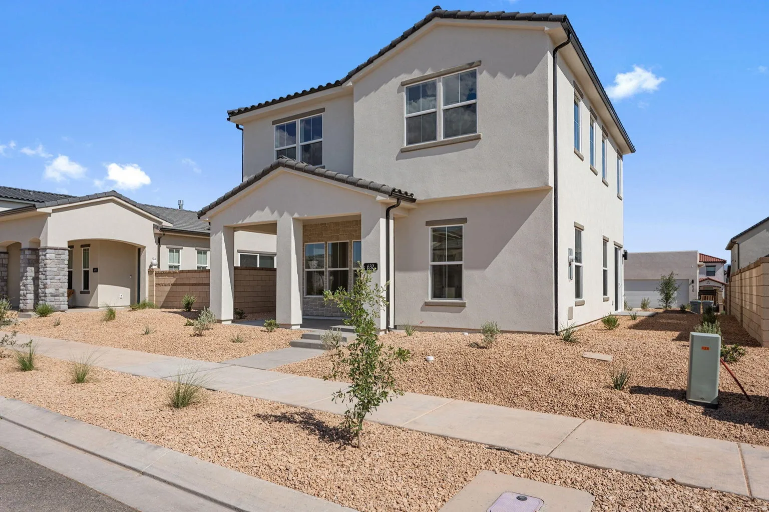 Mediterranean / spanish-style house featuring stucco siding and a tiled roof