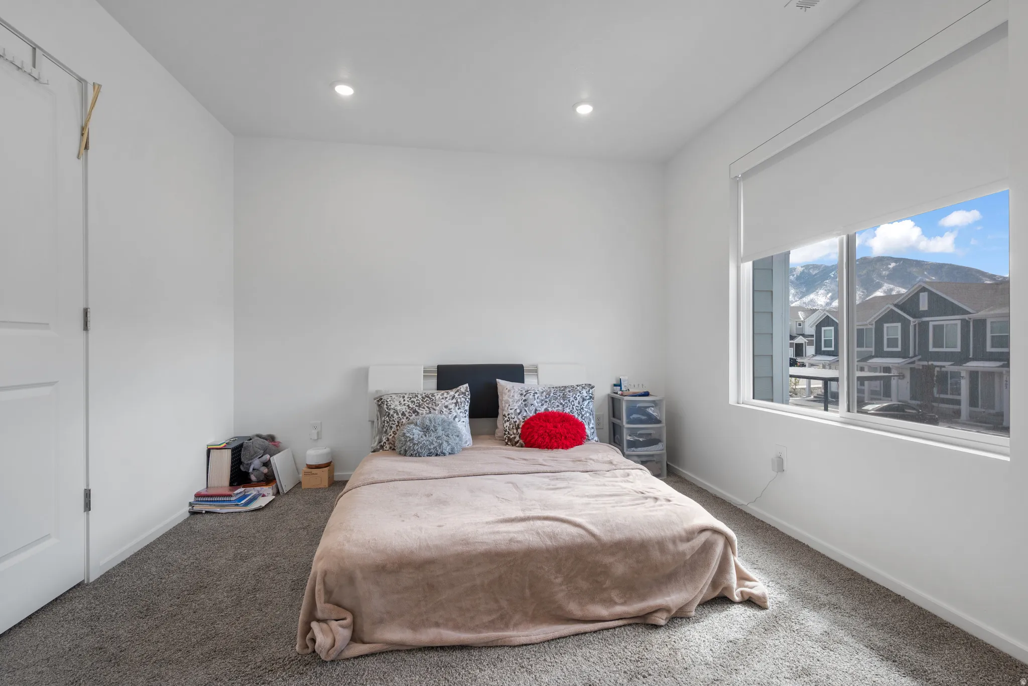 Bedroom with carpet flooring, a mountain view, and recessed lighting