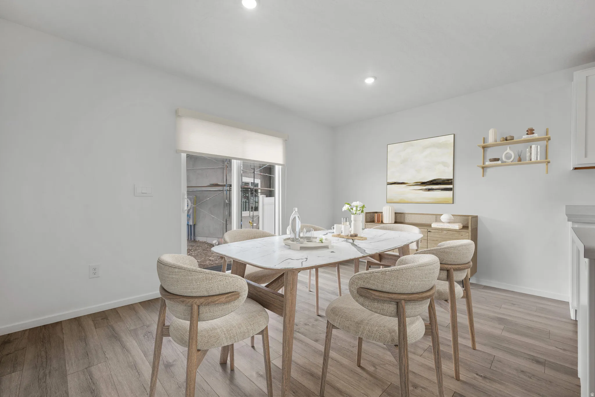 Dining space featuring light wood-style flooring and recessed lighting