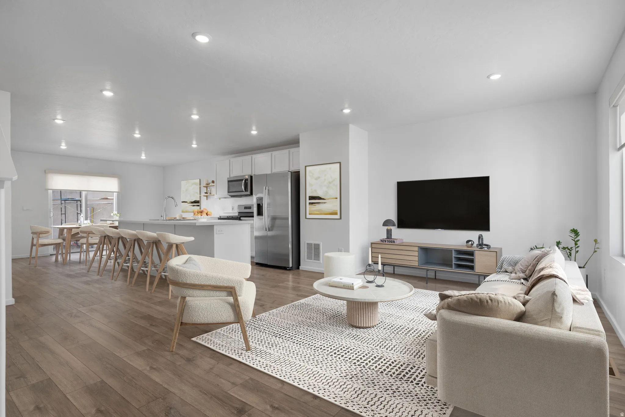 Living area featuring dark wood-style flooring and recessed lighting