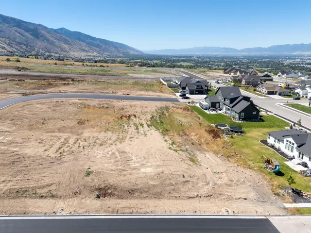 Aerial perspective of suburban area with a mountainous background