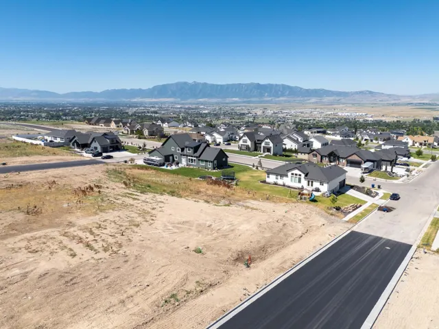 Aerial perspective of suburban area featuring a mountainous background