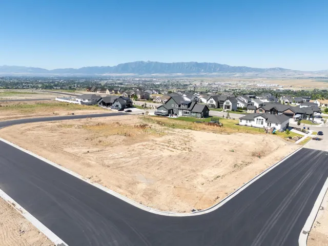 Aerial perspective of suburban area featuring a mountain backdrop