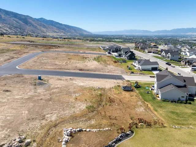 View of property location with a mountainous background and nearby suburban area