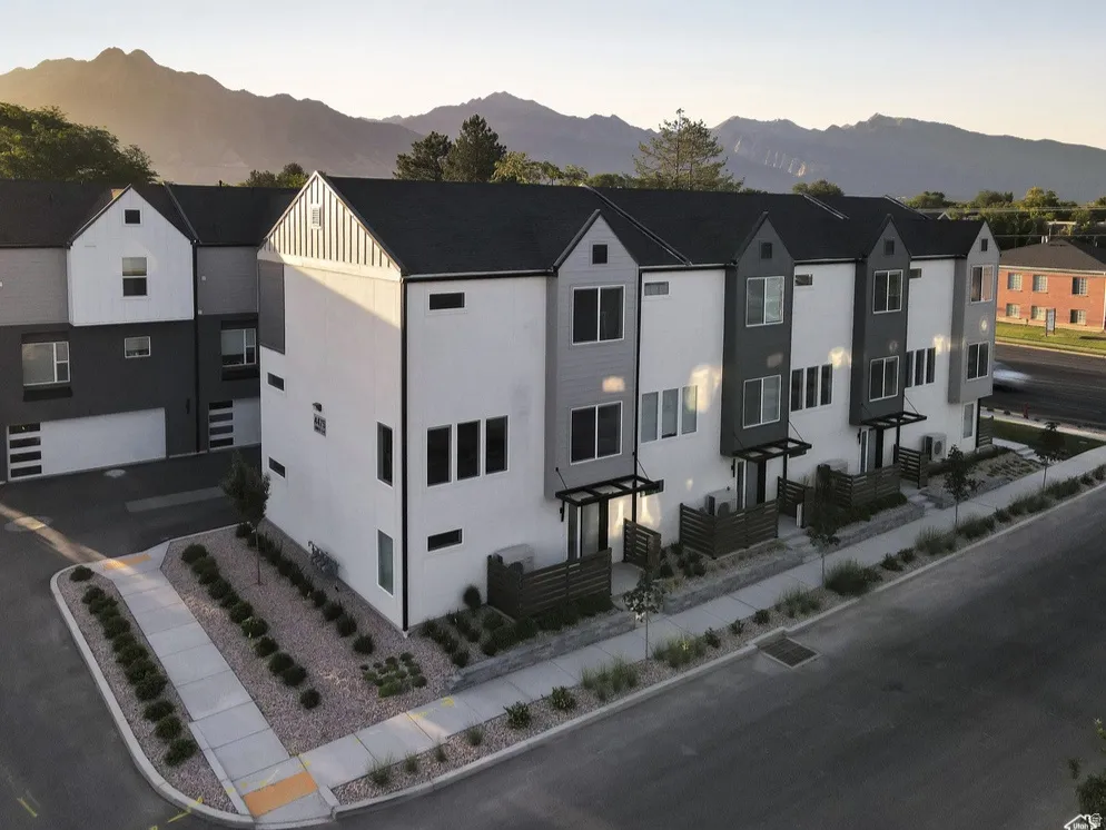 View of front of home with a mountain view and stucco siding