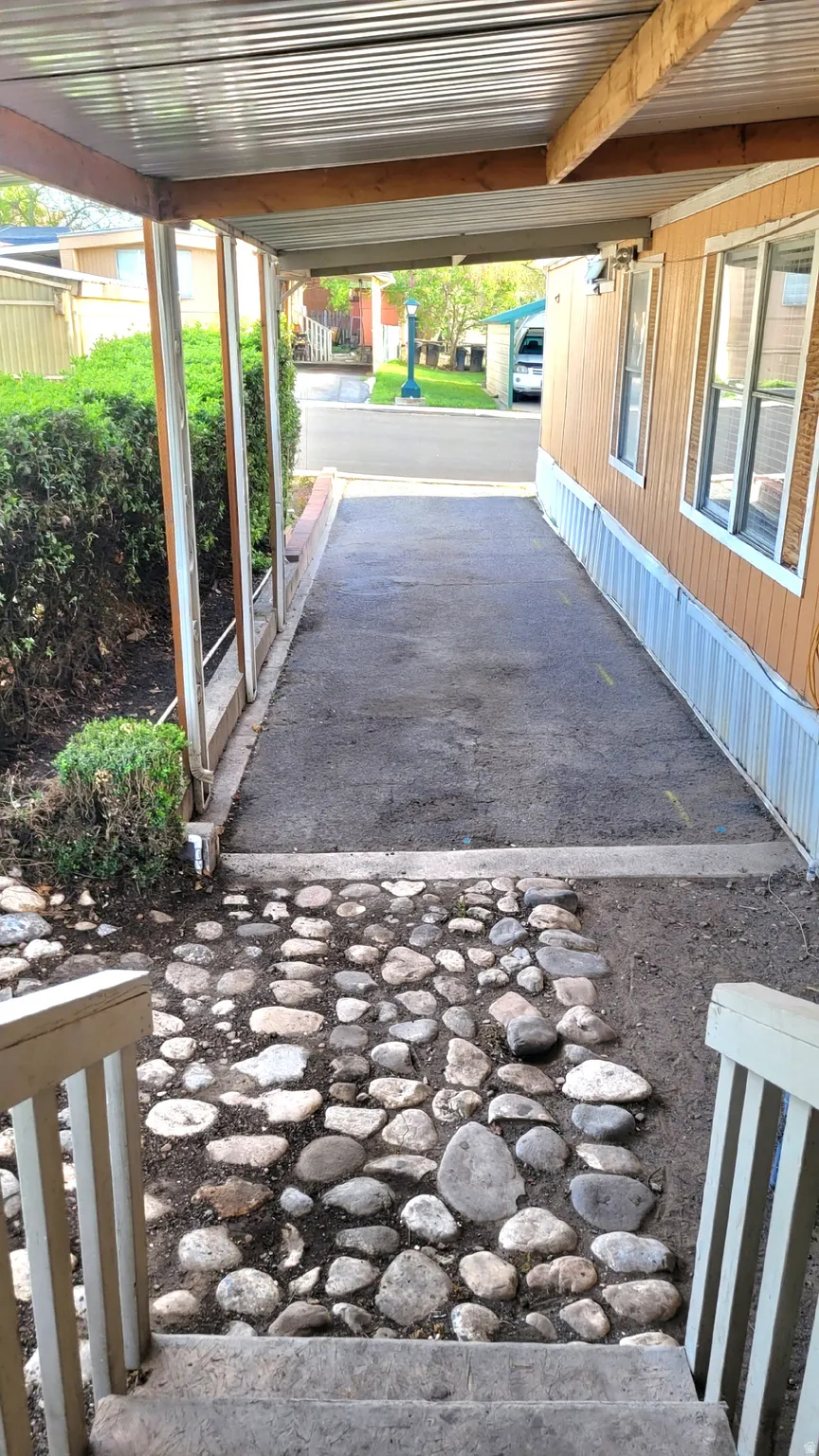 View of back deck by covered parking