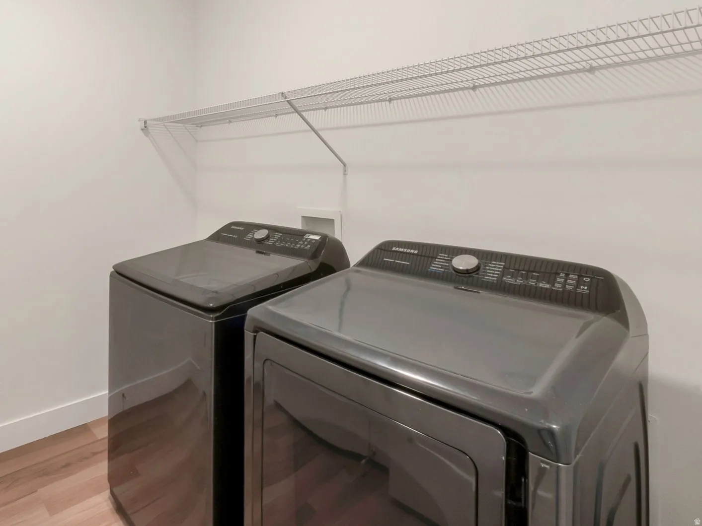 Washer & Dryer staying. Large Pantry/Closet across from the machines.