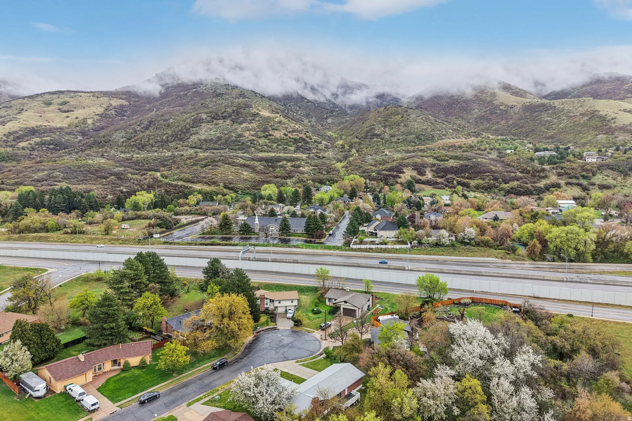 Aerial view of residential area featuring mountains