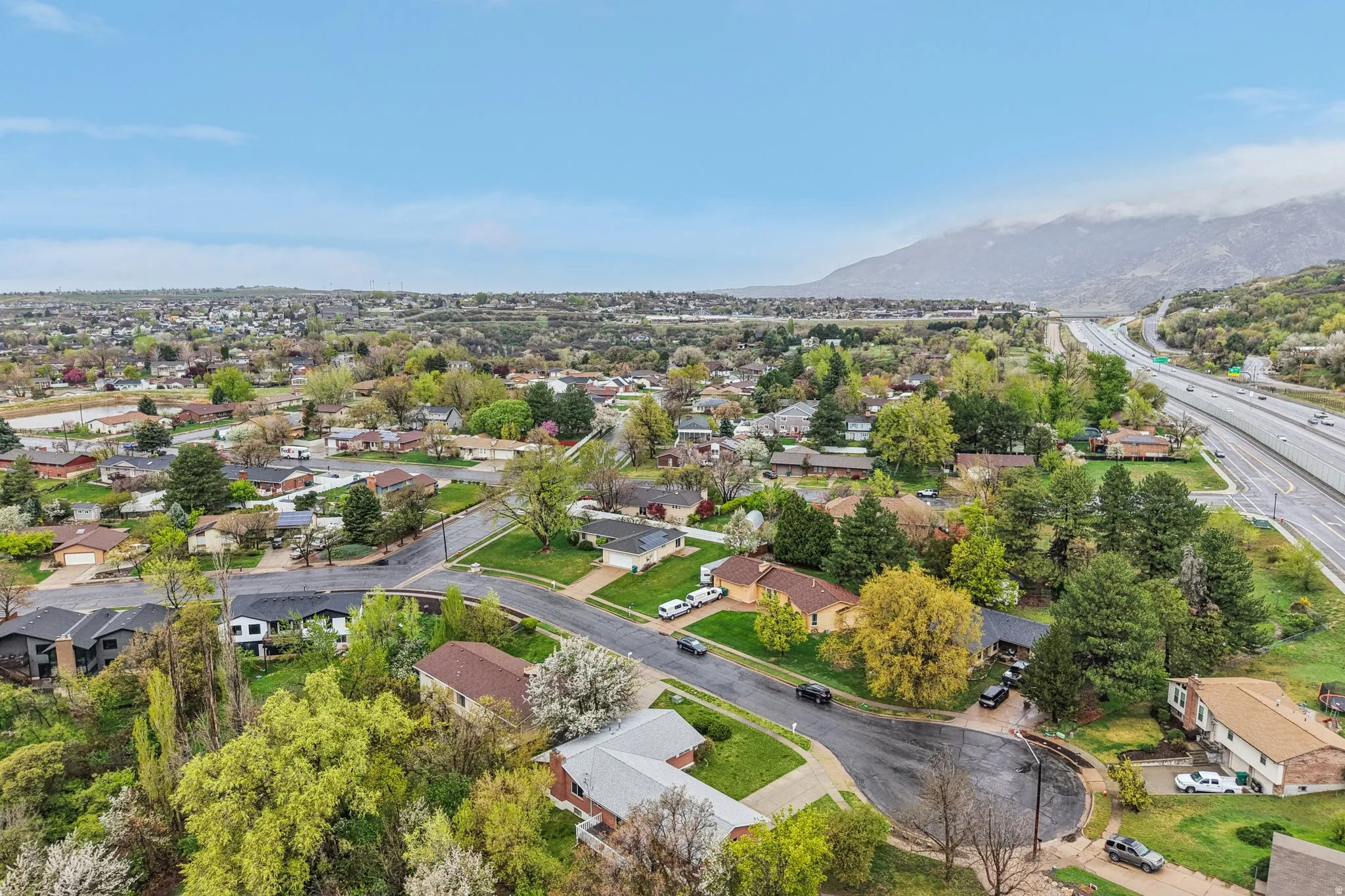 Aerial perspective of suburban area featuring mountains