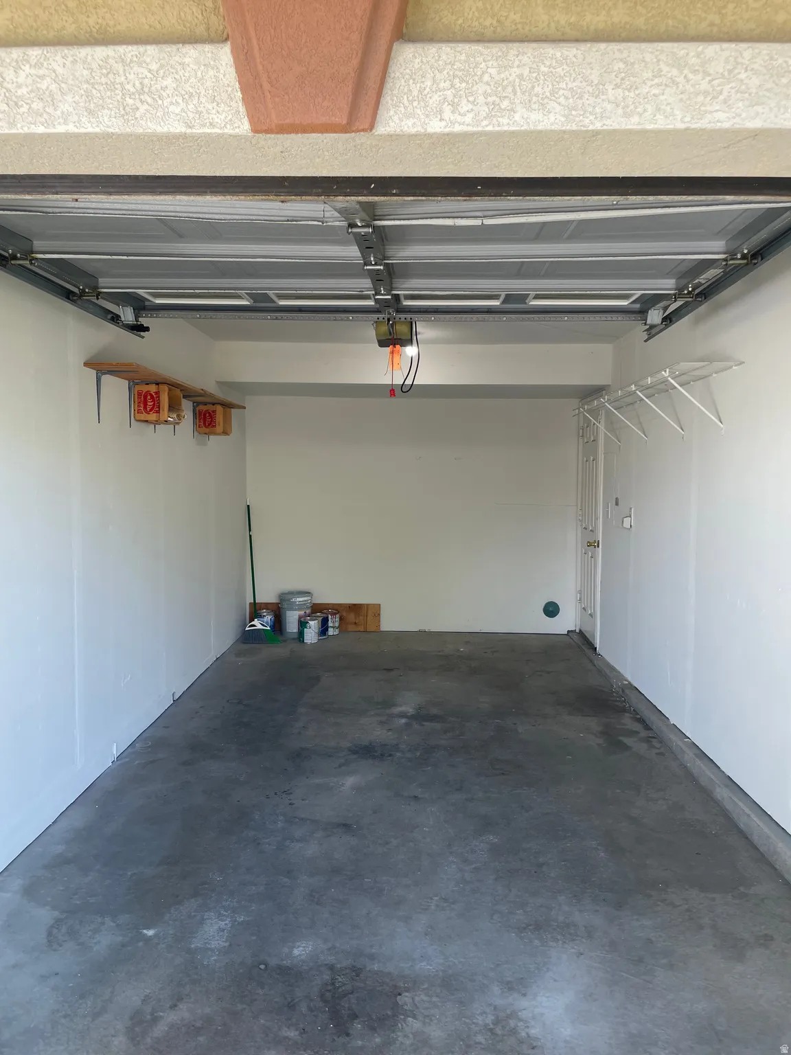 Photo is of a garage from another unit for reference.
