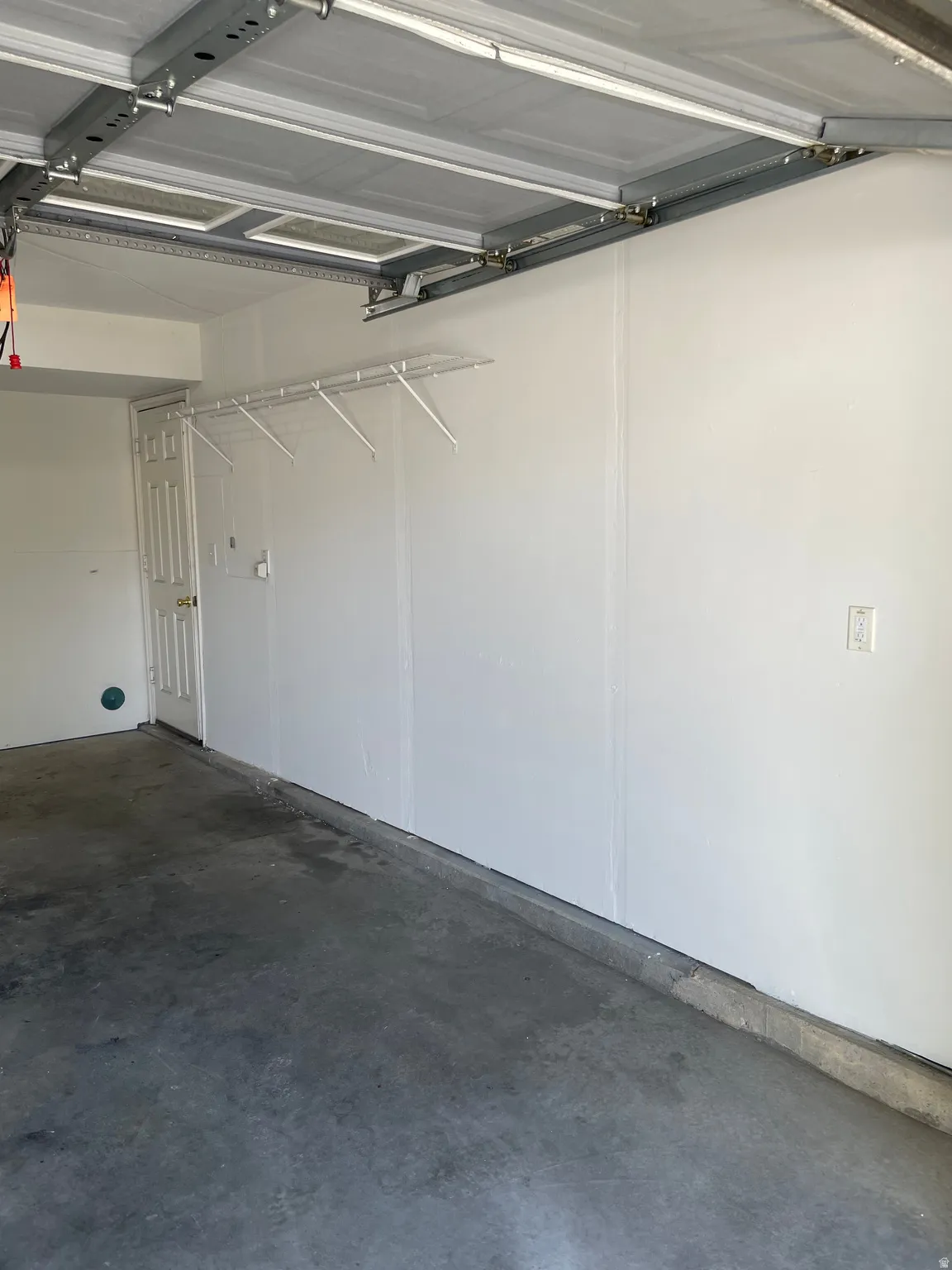 Photo is of a garage from another unit for reference.
