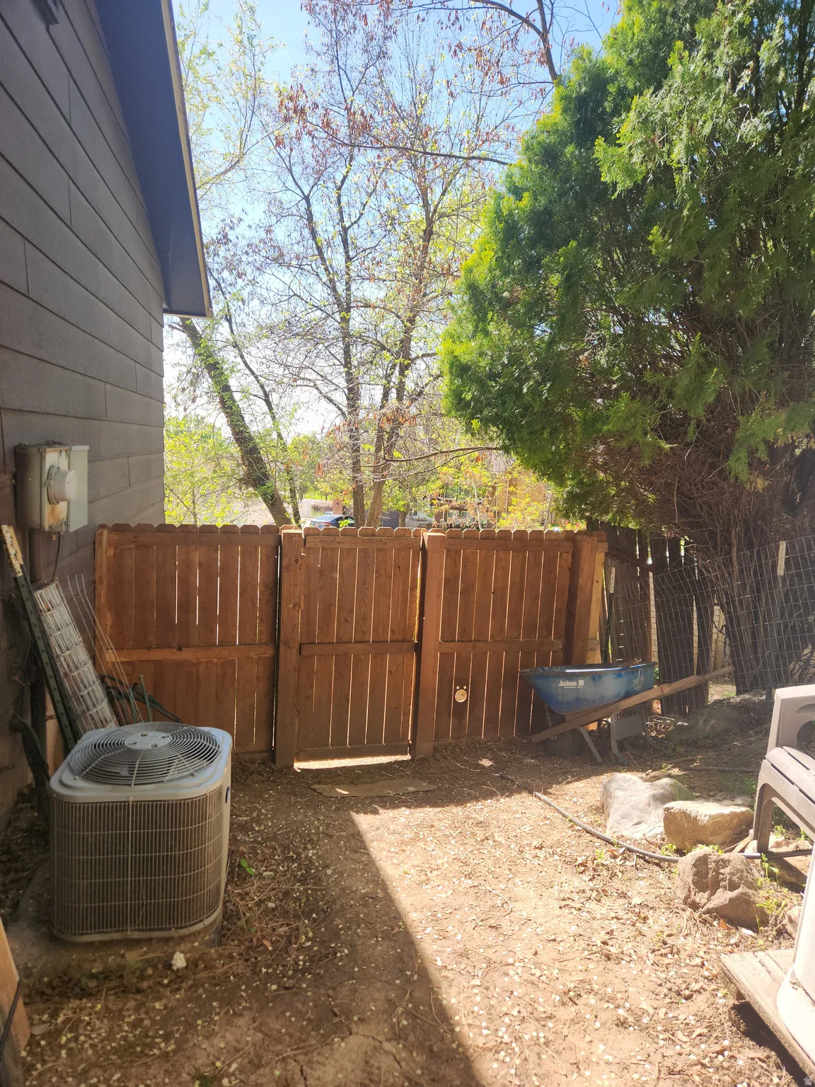 Fenced yard featuring a gate