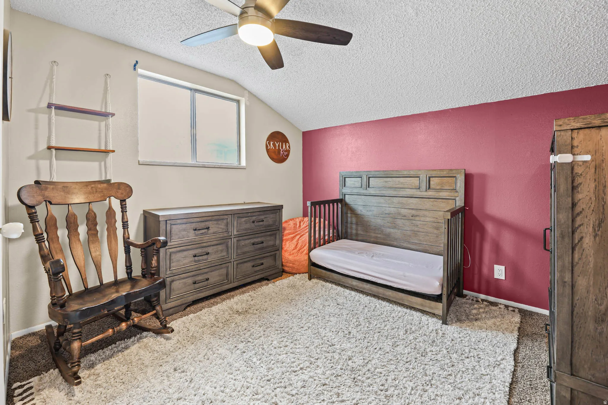 Bedroom with ceiling fan and light colored carpet