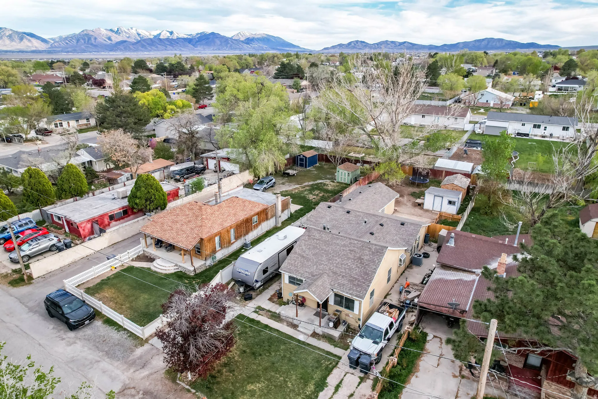 Aerial view of residential area featuring a mountainous background