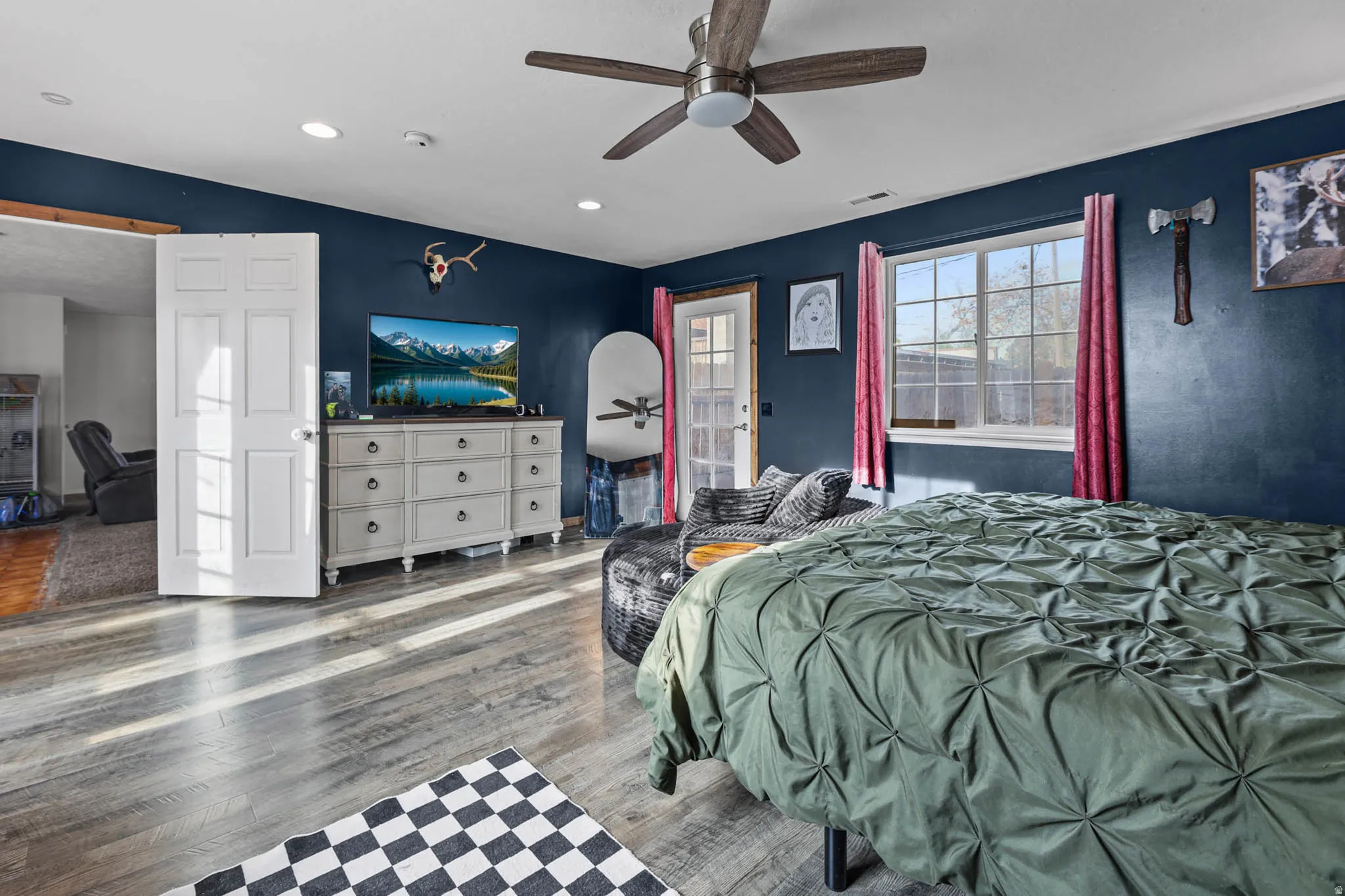 Bedroom featuring wood finished floors, ceiling fan, recessed lighting, and vaulted ceiling