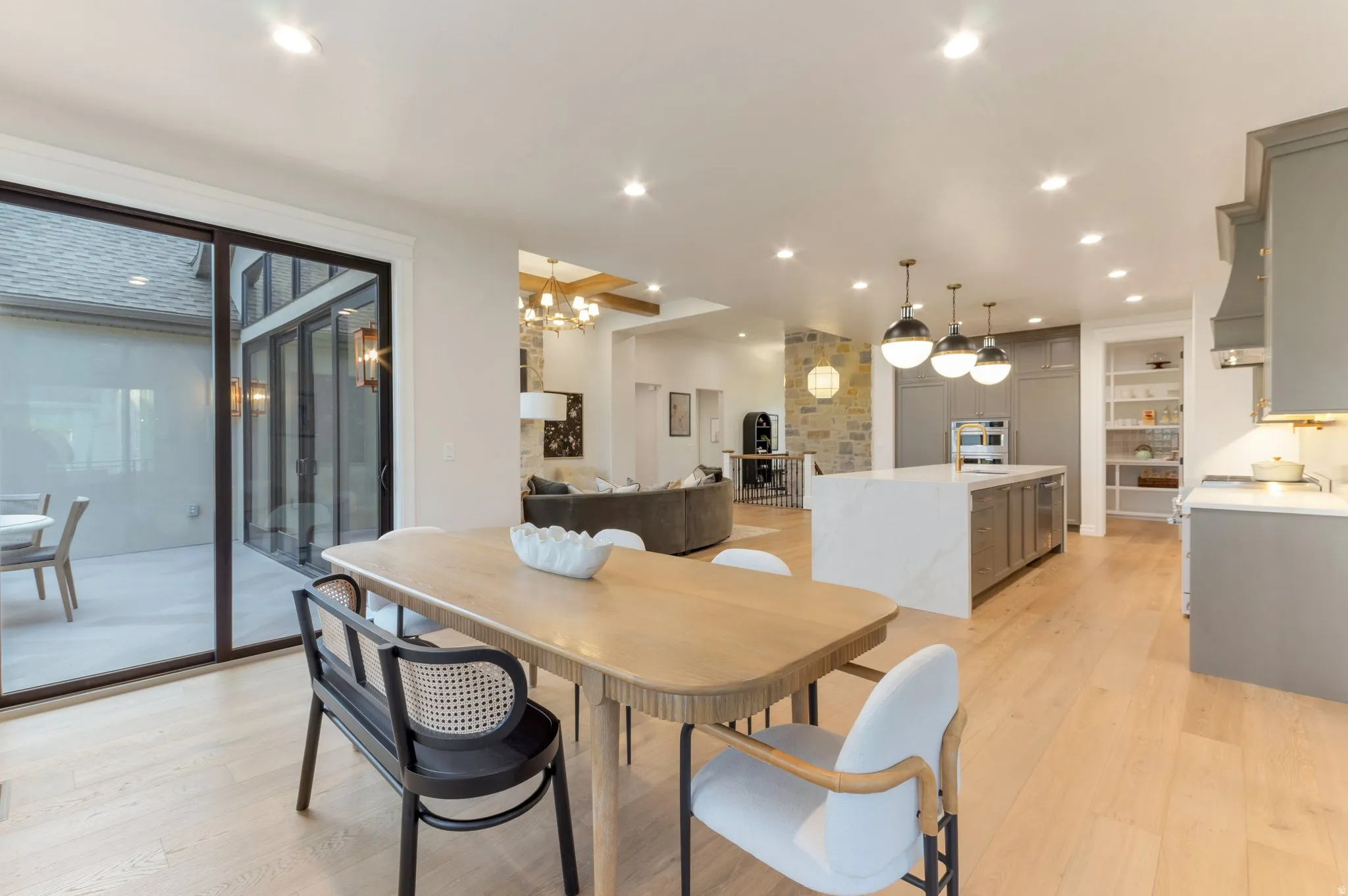 Dining room featuring light wood-style flooring and suspended lighting