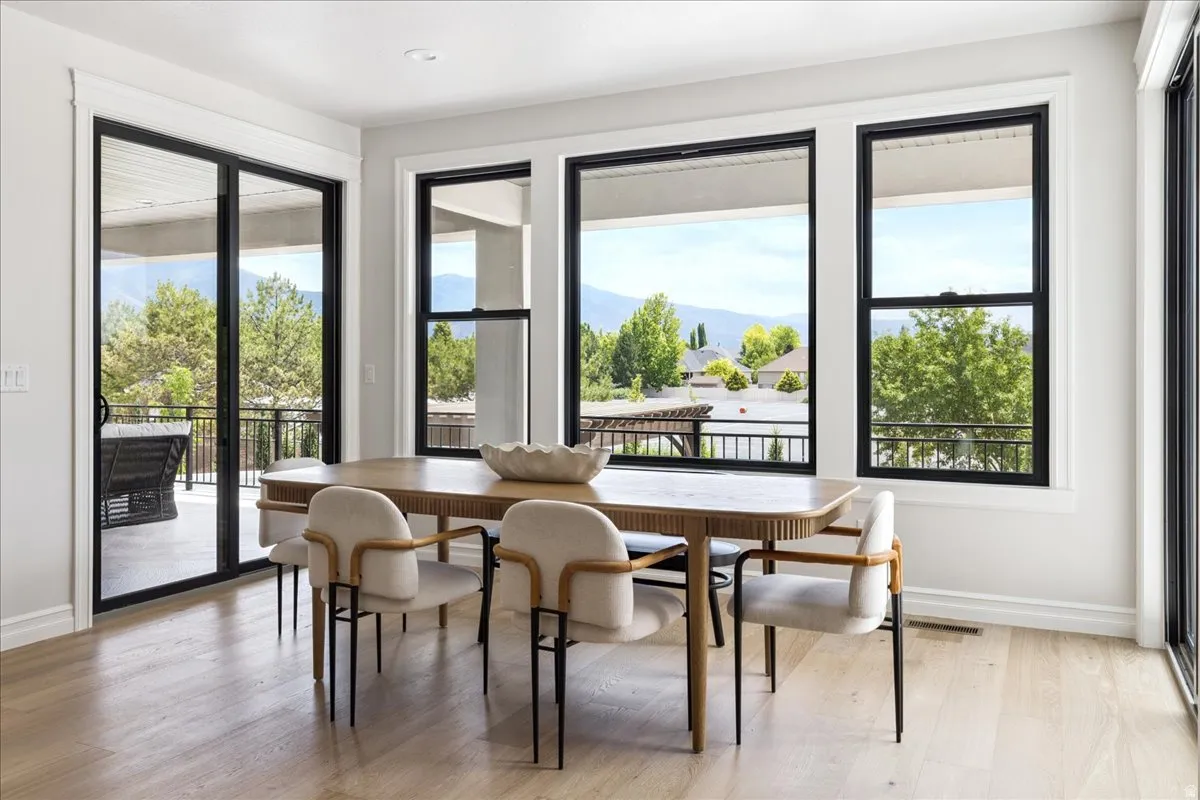 Dining space featuring light wood-style flooring and a mountain view