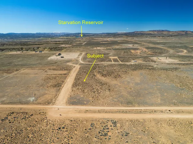 View of rural area featuring a desert landscape and a mountain backdrop