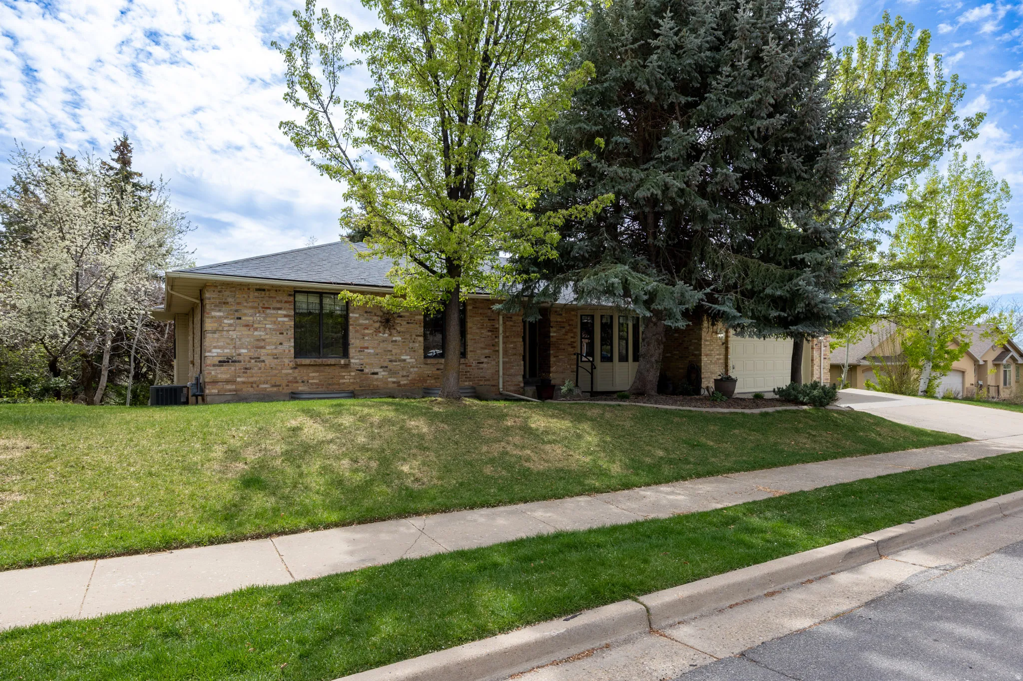East Layton all brick rambler on wooded lot with views.