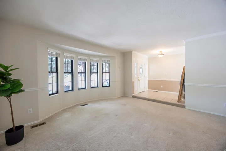 Formal living room perfect for a piano or reading room.
