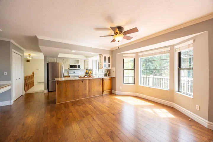 Large family room and dining area with great view of the kitchen.