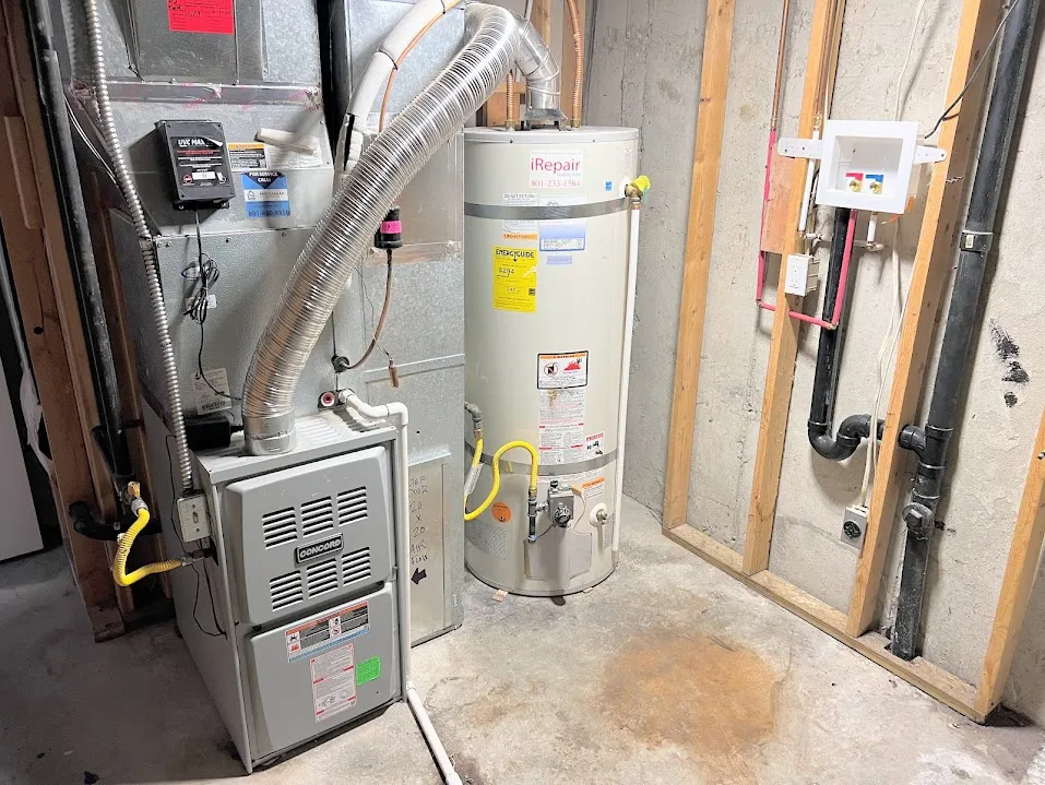 Utility room with heating unit and strapped water heater