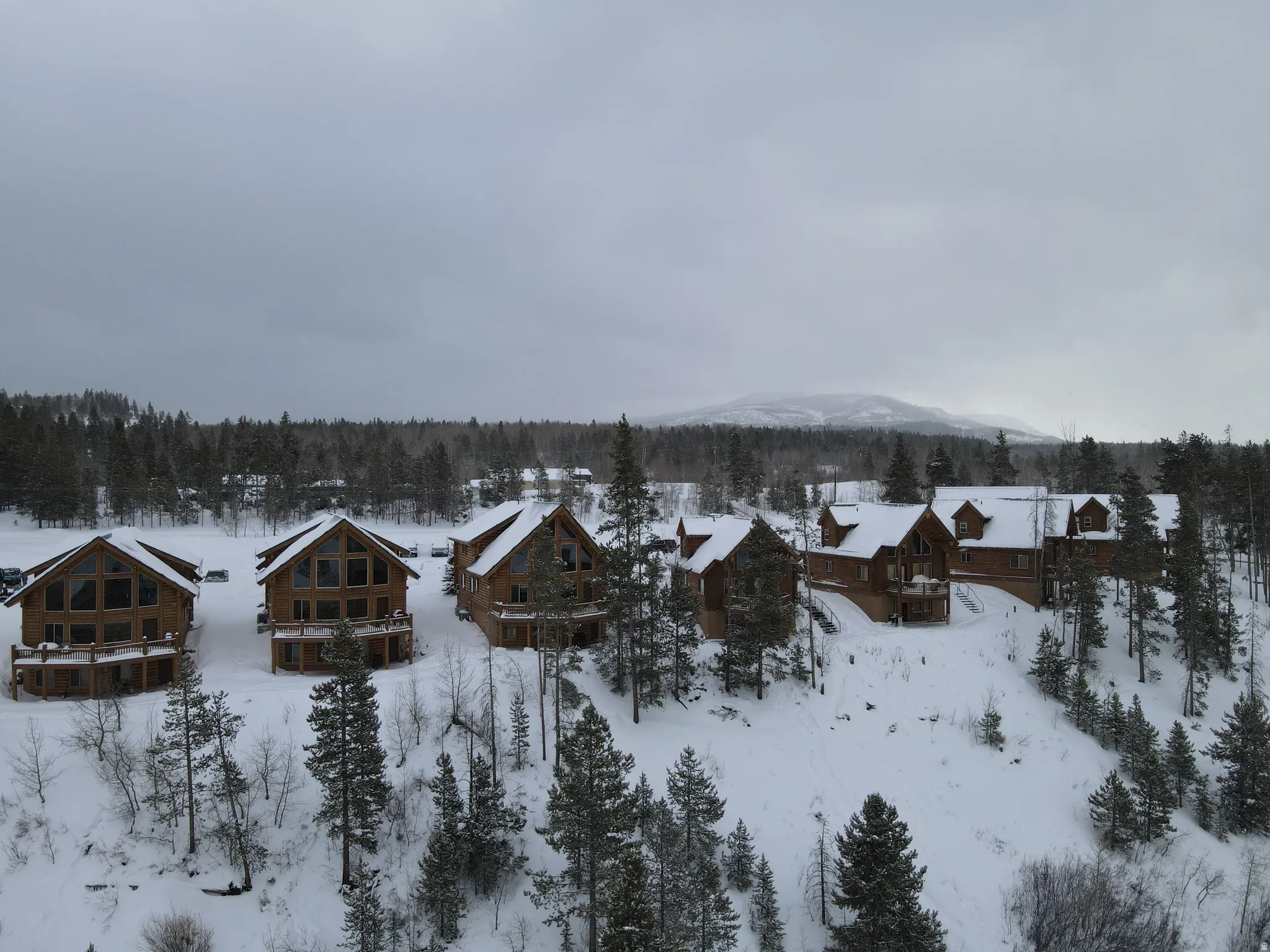 Snowy aerial view featuring a residential view