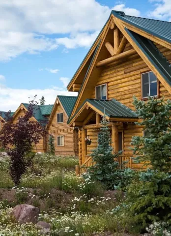 Log home with log exterior and a metal roof