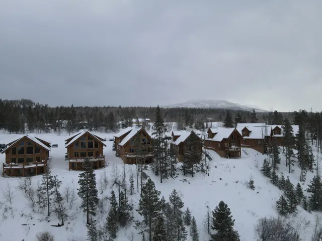 Snowy aerial view featuring a residential view