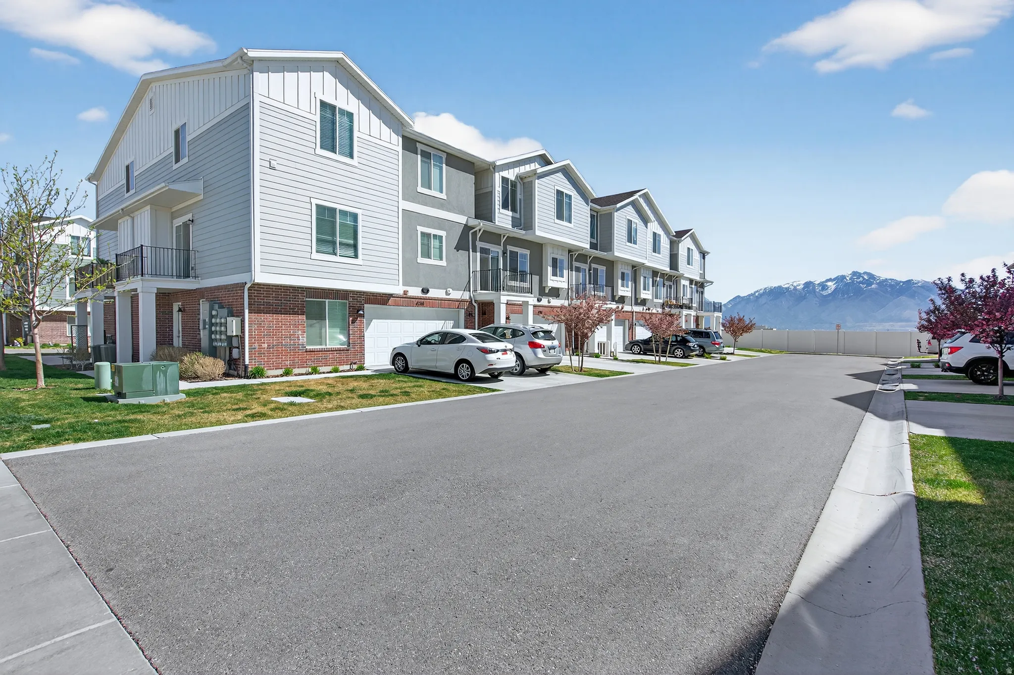 View of asphalt street featuring a residential view and a mountain view