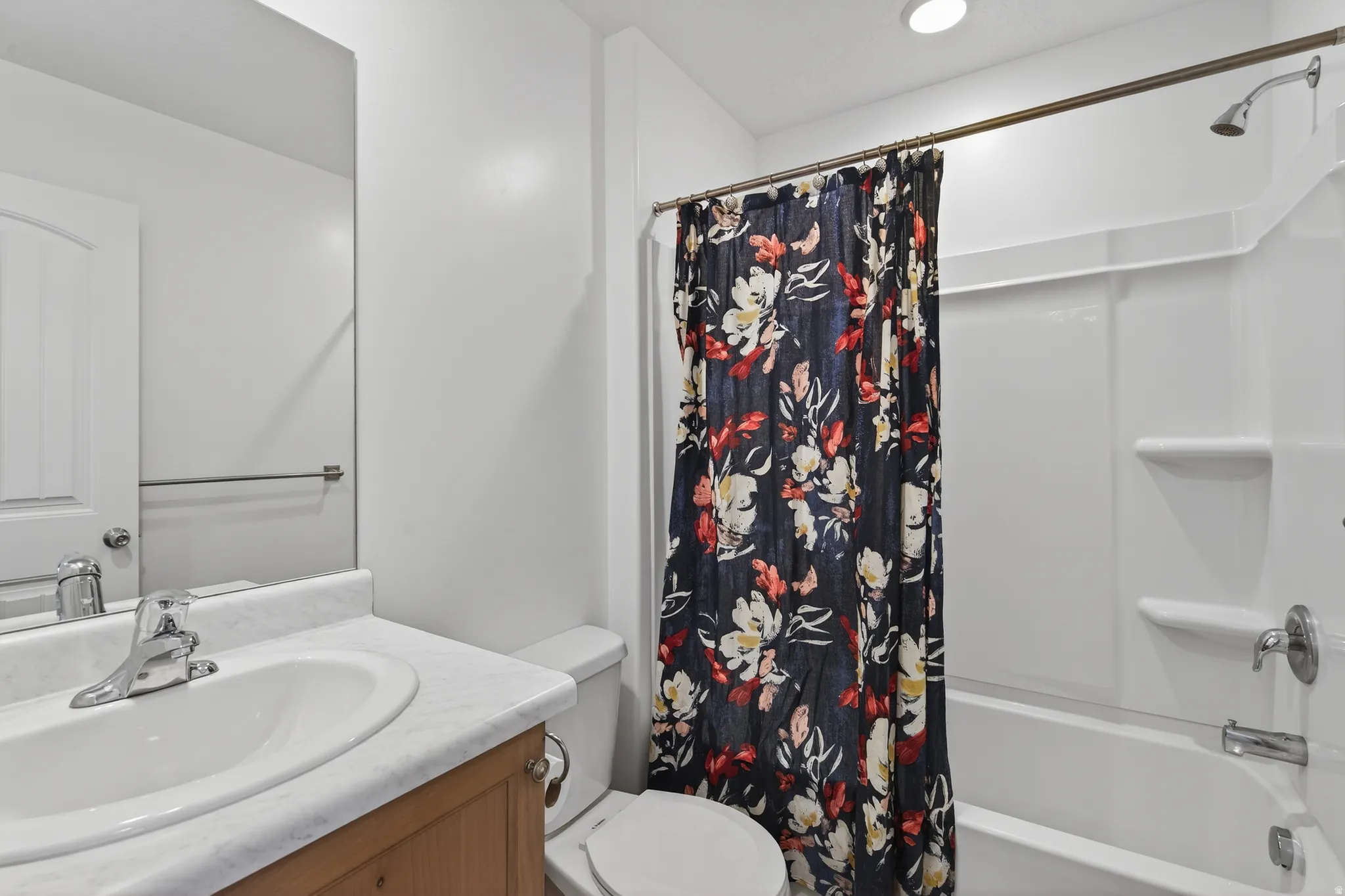 Full bathroom with vanity and shower / bathtub combination with curtain